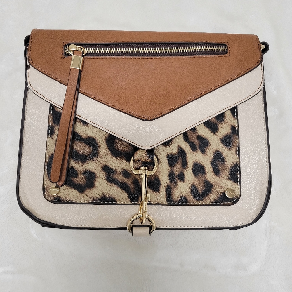 Tan/Leopard Handbag. Button Closure. Zipper Compartment in the Front and Back.